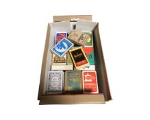A box of approximately 30 sets of playing cards