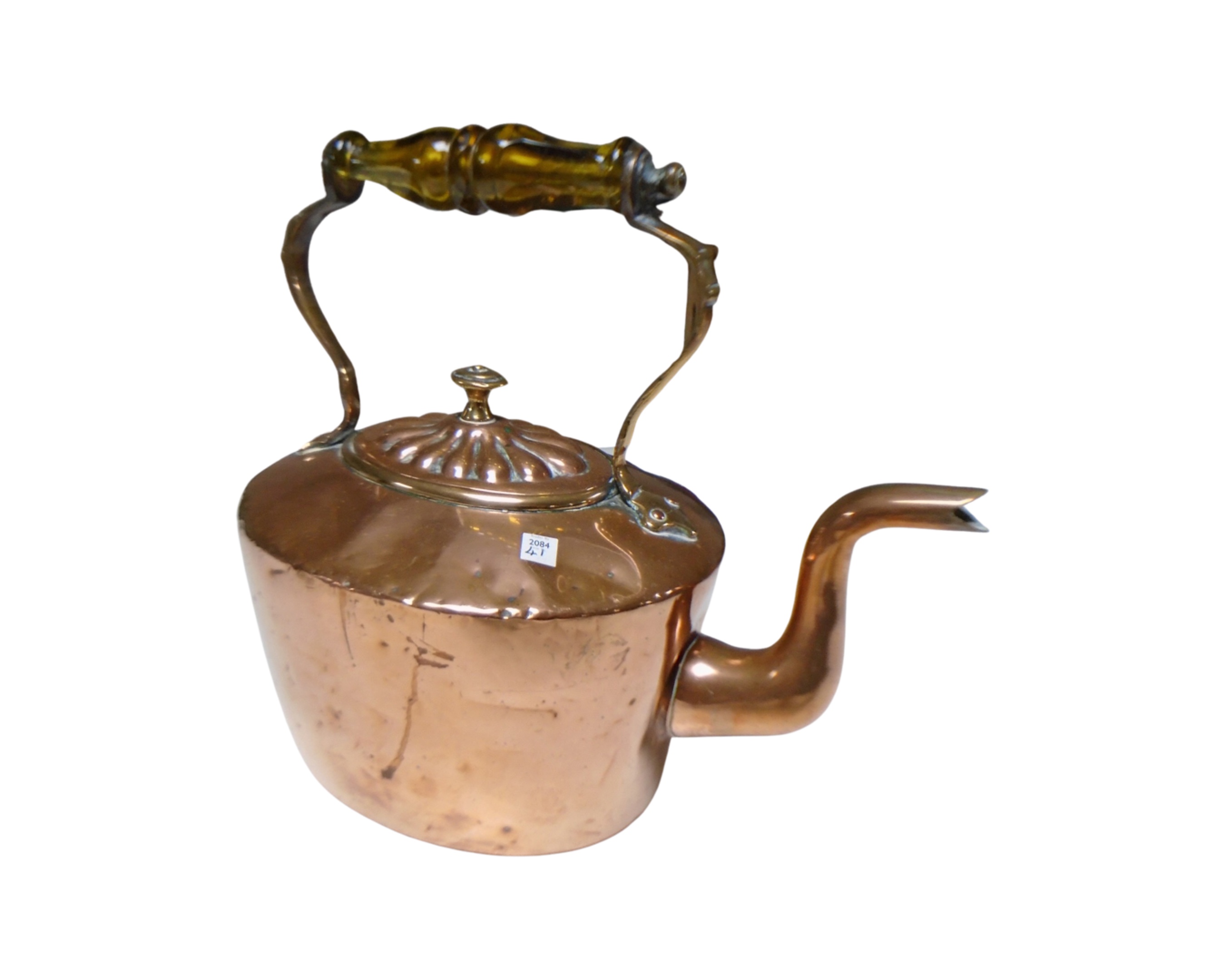 An antique copper kettle.