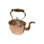 An antique copper kettle.