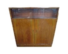 A 20th century walnut double door cabinet,