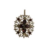 A 9ct yellow gold garnet and seed pearl brooch / pendant, 7.8g, 40 mm (inc bale) x 29 mm.