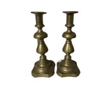 A pair of Victorian brass candlesticks.