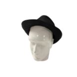 A ceramic mannequin head together with a hat