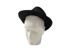 A ceramic mannequin head together with a hat