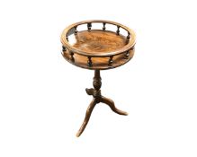 A mahogany wine table with gallery