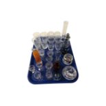 A tray containing assorted glassware including a sugar sifter, vases, Stuart Crystal rose bowl,