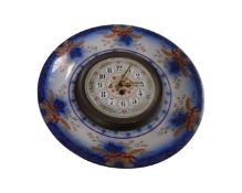 An antique ceramic plate clock