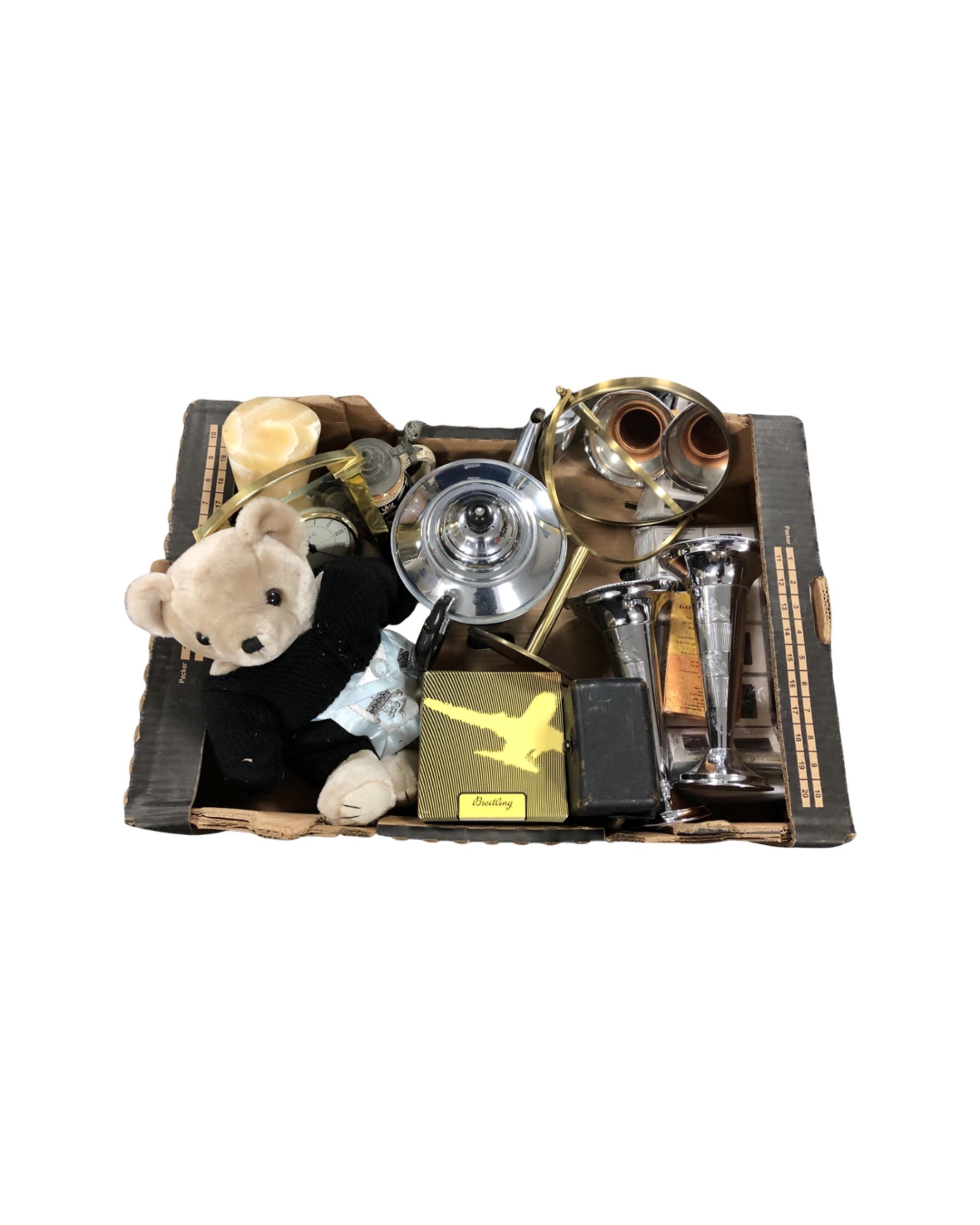 A box containing a teddy bear, Megger meter, plated wares, a Breitling watch box etc.