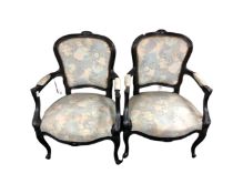 A pair of French style salon armchairs in floral fabric (painted)