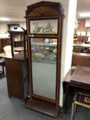 An inlaid mahogany hall mirror with shelf and painted panel above,