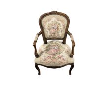 A beech framed French salon armchair in tapestry fabric