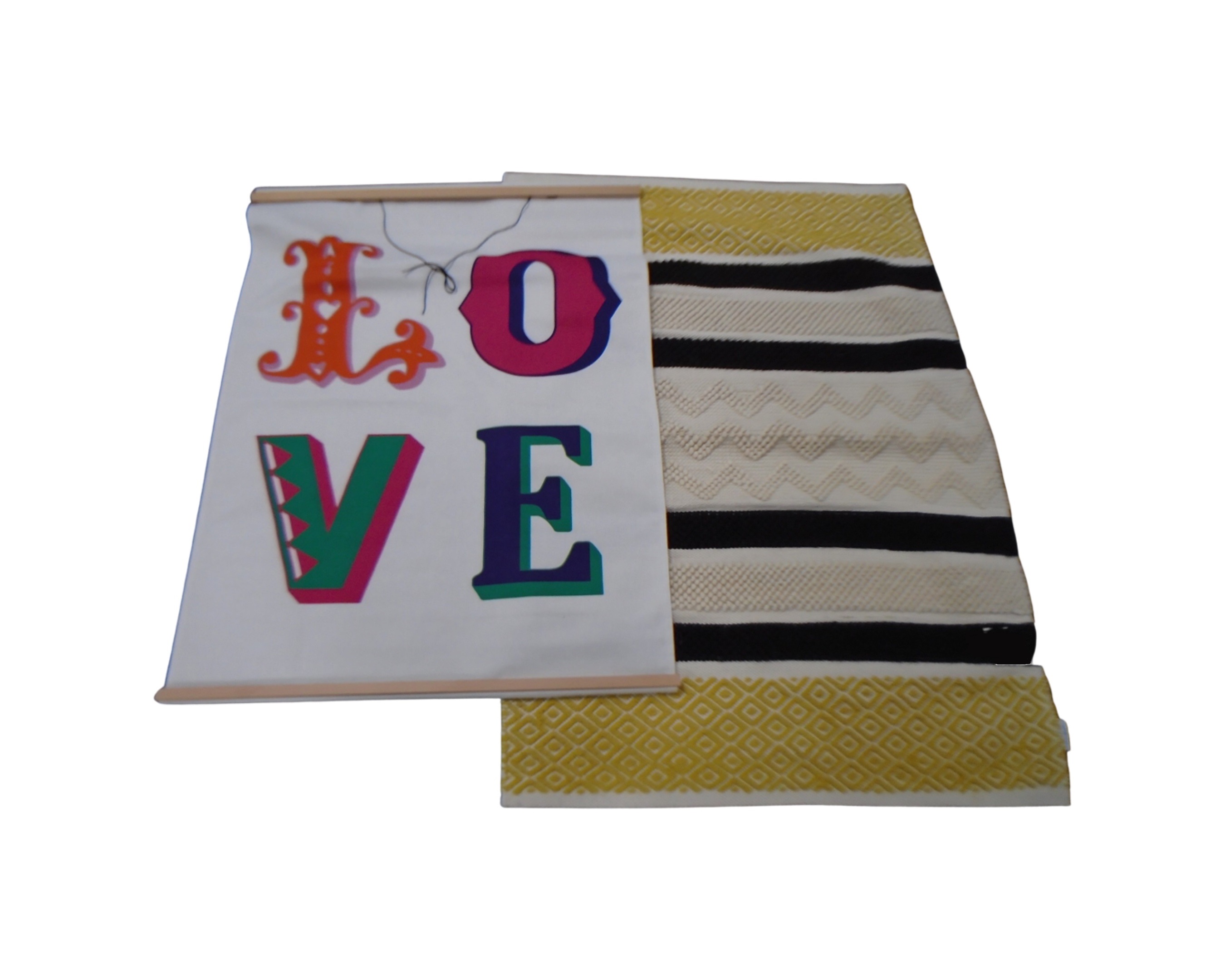 An Erica Davis woolen rug together with a fabric wall hanging 'Love'