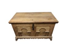 A 19th century carved oak blanket box with key,