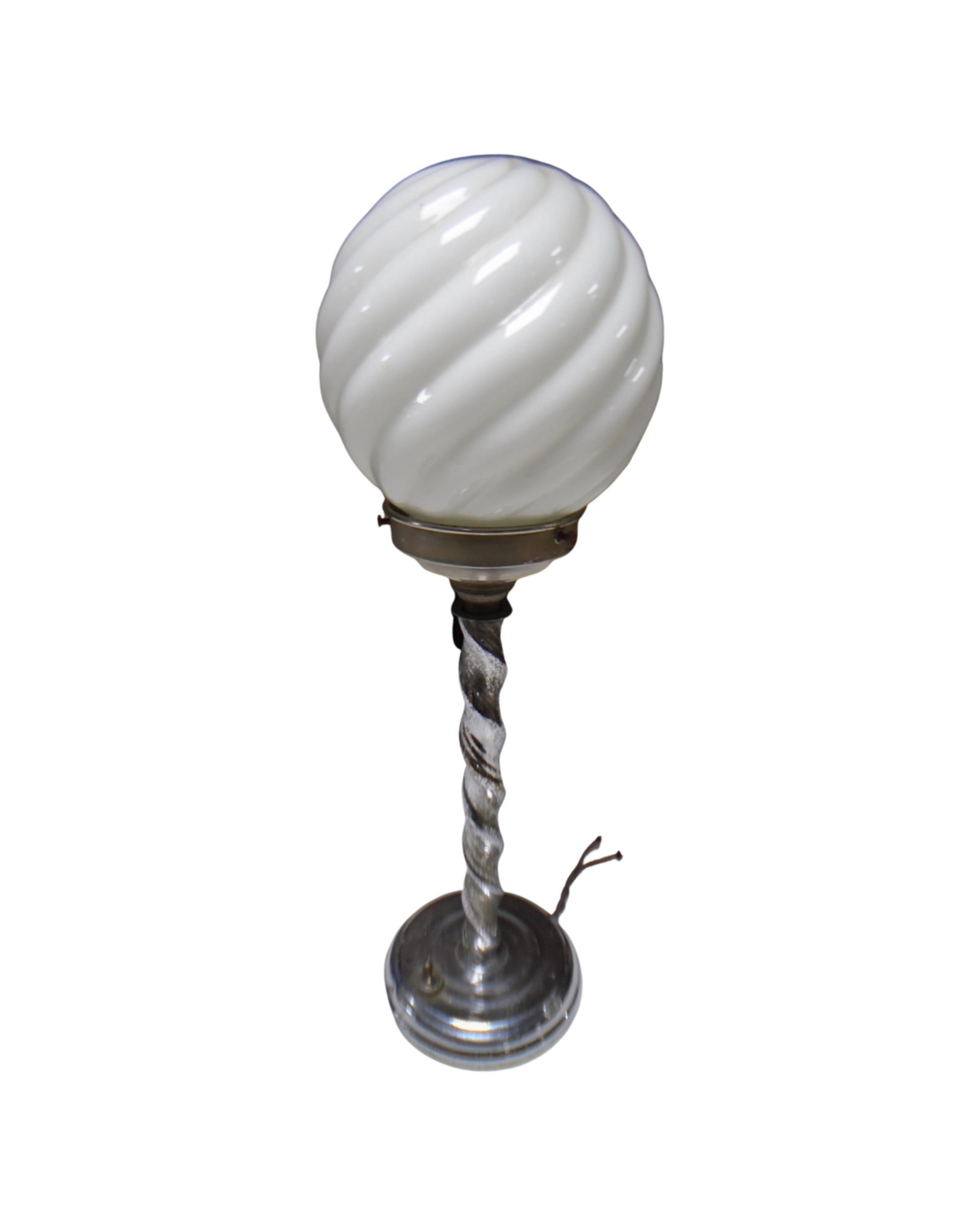 A chrome barley twist Art Deco table lamp with opaque ball shade.