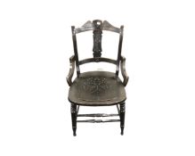 An ebonised Edwardian chair together with a standard lamp