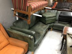 A 1970's Danish green leather corner settee with footstool