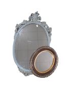 A Rococo style wall mirror together with a further oval mirror