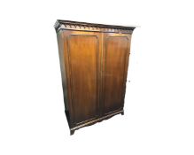 A Bevan Funnel mahogany Victorian style double door wardrobe,