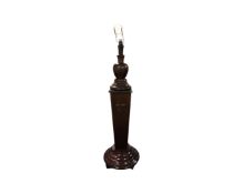 An early 20th century heavy mahogany and beech pedestal standard lamp,
