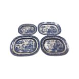 Four 19th century blue and white willow pattern meat and turkey plates.