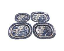 Four 19th century blue and white willow pattern meat and turkey plates.