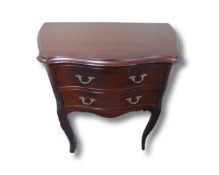 A continental serpentine fronted two drawer commode chest,