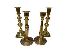 Two pairs of brass candlesticks.