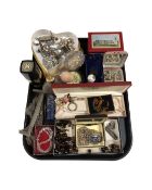 A tray containing assorted costume jewellery, perfume and dressing table bottles, a chainmail purse,