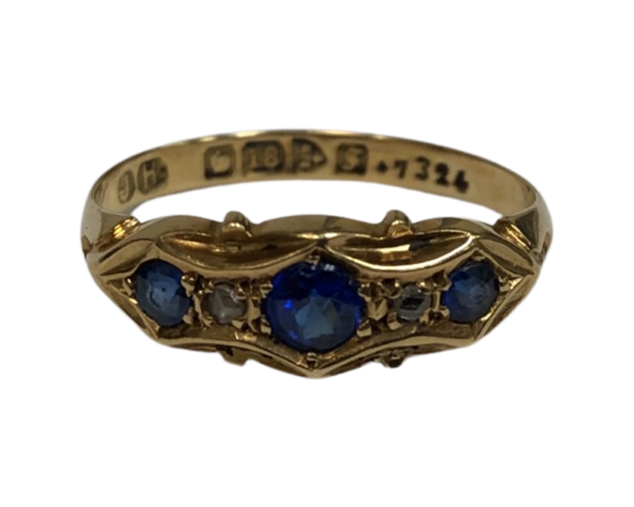 An 18ct yellow gold ring set with three synthetic sapphires, size M, 2.1g.