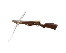 A mahogany and brass crossbow