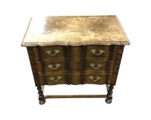 A carved oak and beech serpentine fronted three drawer chest, width 65 cm,