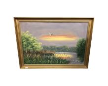Continental school : Duck in flight over a lake, oil-on-canvas, in gilt frame, initialed P. J.