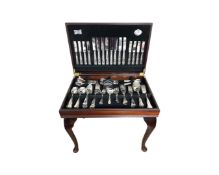 A Cooper Ludlam silver plated cutlery set in table