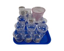 A tray containing assorted glassware including a milk glass bowl, glass vase,