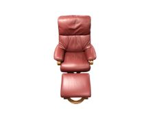 A Himolla red leather adjustable reclining armchair with footstool
