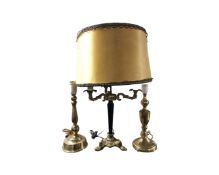 An early 20th century gilt metal three way table lamp with shade together with two further table