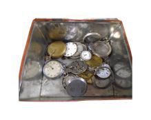 A vintage Phenosan tin containing pocket watches, pocket watch cases and movements.