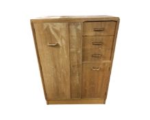 A mid century G-Plan E Gomme light oak small compactum wardrobe,