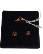 A 9ct gold ring set wth synthetic ruby together with matching pair of earrings.