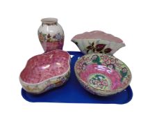 Four pieces of Maling pottery in pink lustre and floral vase.