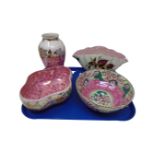 Four pieces of Maling pottery in pink lustre and floral vase.