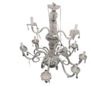 An antique style crystal chandelier with barley twist stem