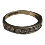 A 9ct gold half eternity ring set with cubic zirconia, size M, 1.9g.