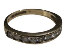 A 9ct gold half eternity ring set with cubic zirconia, size M, 1.9g.