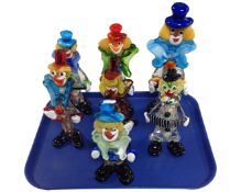 Seven Murano glass clown figures.