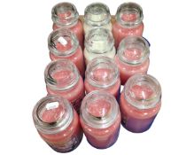 A collection of 11 Yankee candles.