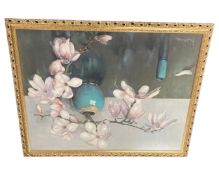 A colour print depicting a blossom in a vase, in gilt frame.
