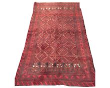 A Bokhara rug of geometric design, Afghanistan, 107cm by 191cm.