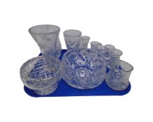 A tray of crystal and glass including storage jars and cut crystal bowl.