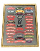 A montage of military cloth badges in frame.